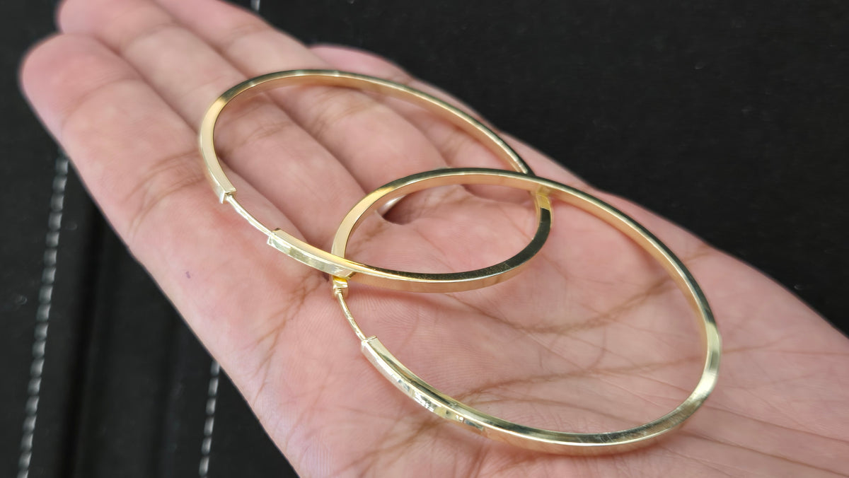 14k Square-edge hoop earrings combine a modern geometric silhouette with classic everyday wear, making them a chic and versatile gift option